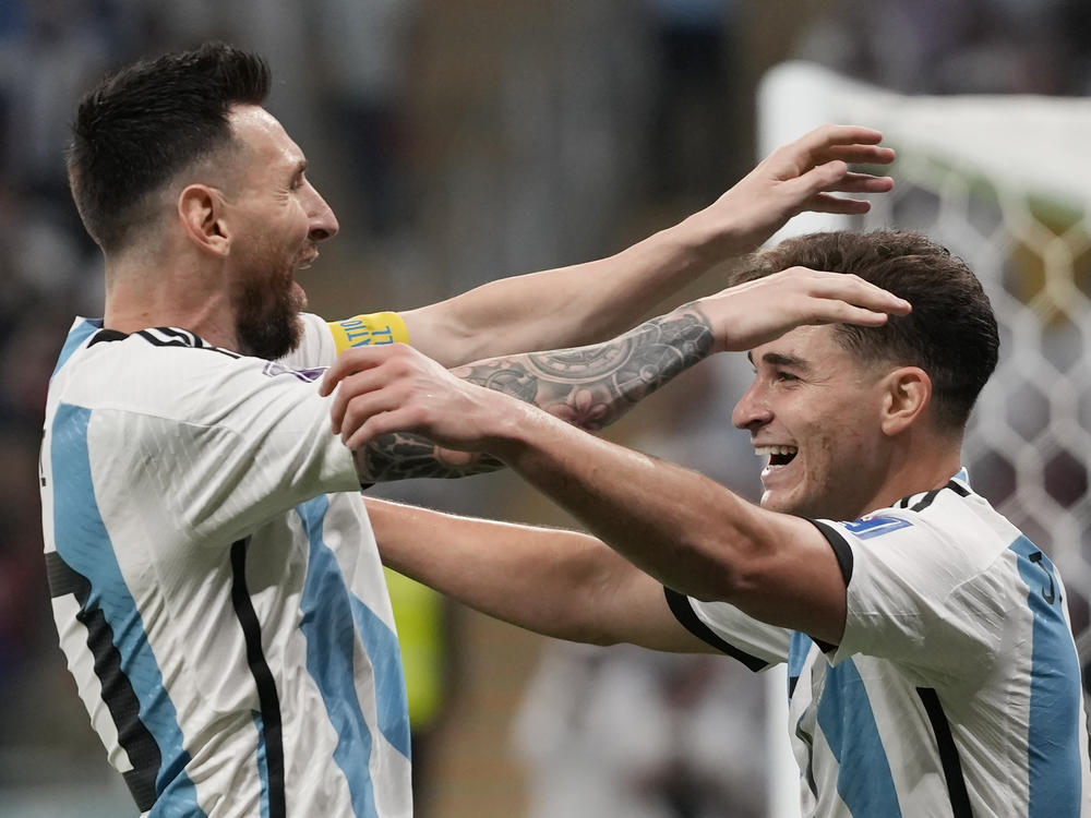 Argentina's Lionel Messi, left, and Julián Álvarez celebrate their side's second goal during the match between Argentina and Australia on Saturday.