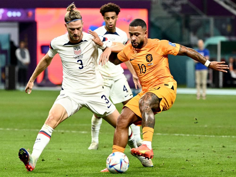 USA defender Walker Zimmerman (#3) fights for the ball with Netherlands' forward Memphis Depay during the 2022 World Cup round of 16 match at Khalifa International Stadium in Al Rayyan, Qatar, on Saturday.