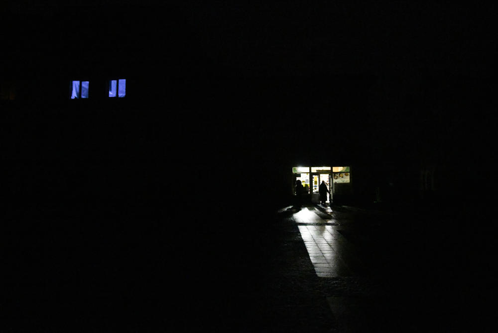 A storefront in Drohobych, Ukraine, during a power outage on Nov. 24. Russian shelling targeting electrical infrastructure across Ukraine resulted in blackouts in many cities.