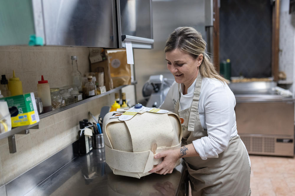 Tiziana Tacchi, Best Italian Host for Slow Food Italy, shows her cooking container in the kitchen of her restaurant in Chiusi, Nov. 12.