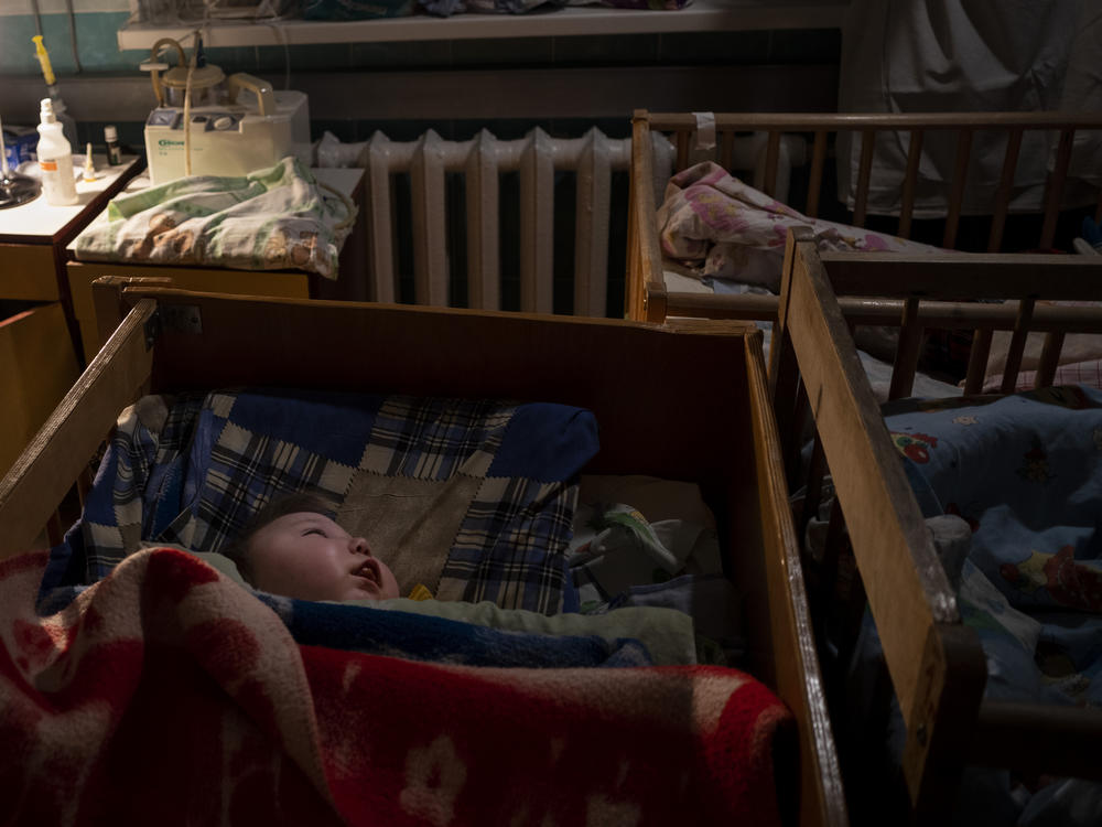 Orphaned children sleep inside cribs at the children's regional hospital maternity ward in Kherson, southern Ukraine, Tuesday, Nov. 22, 2022. At least 1,000 children were seized from schools and orphanages in the Kherson region during Russia's eight-month occupation of the area, their whereabouts still unknown.