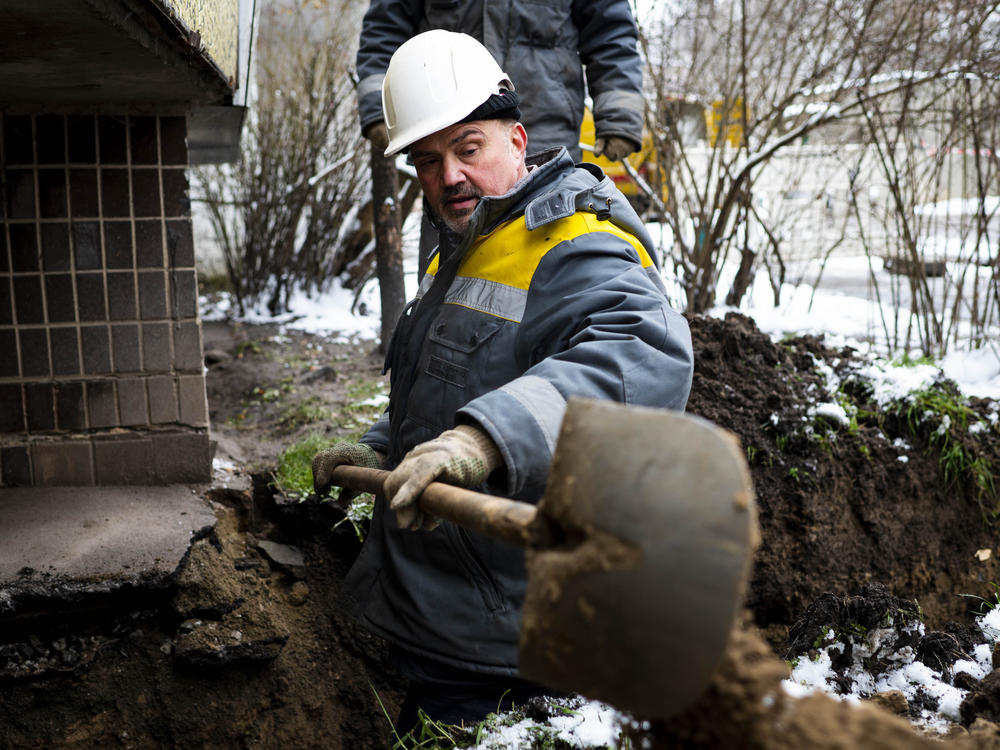 Technicians from DTEK, Ukraine's largest private energy company, work to replace a cable at a substation in the Teremky neighborhood of Kyiv on Wednesday.