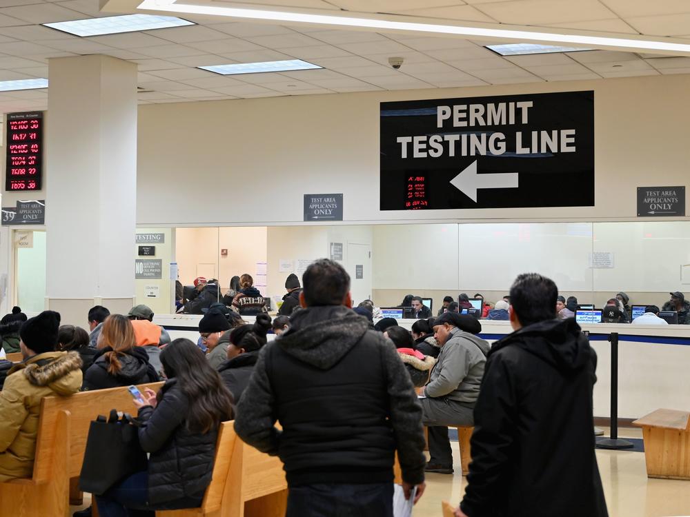 People wait at the New York State Department of Motor Vehicles office at Atlantic Center in the Brooklyn borough of New York on December 18, 2019.