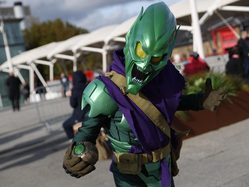 A cosplayer dressed as the Green Goblin poses for a photograph on arrival to attend the MCM Comic Con at the ExCeL exhibition center in London on Oct. 28.