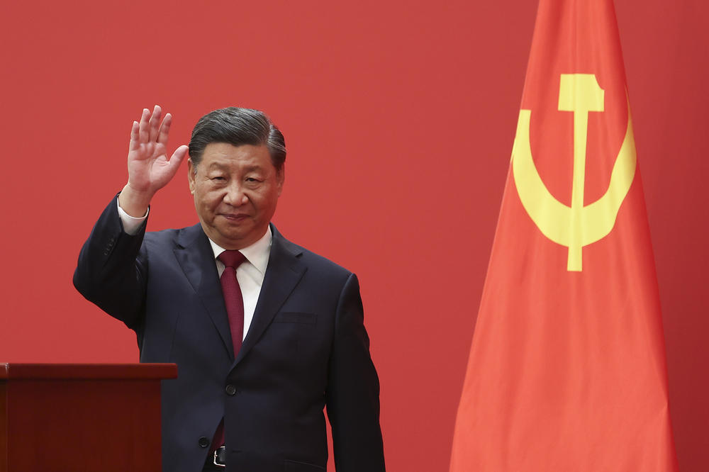 Chinese President Xi Jinping waves during between Communist Party officials and Chinese and foreign journalists at the Great Hall of People in Beijing on Oct. 23.