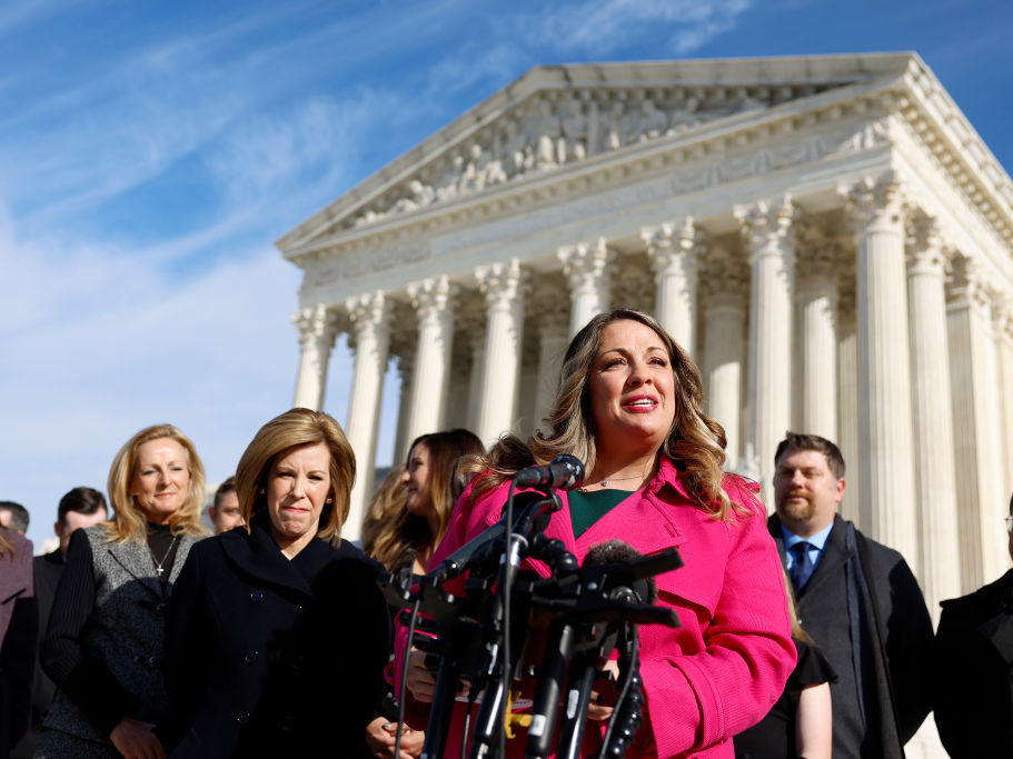 Lorie Smith, the owner of 303 Creative, a website design company in Colorado, speaks Monday to reporters outside of the U.S. Supreme Court in Washington.