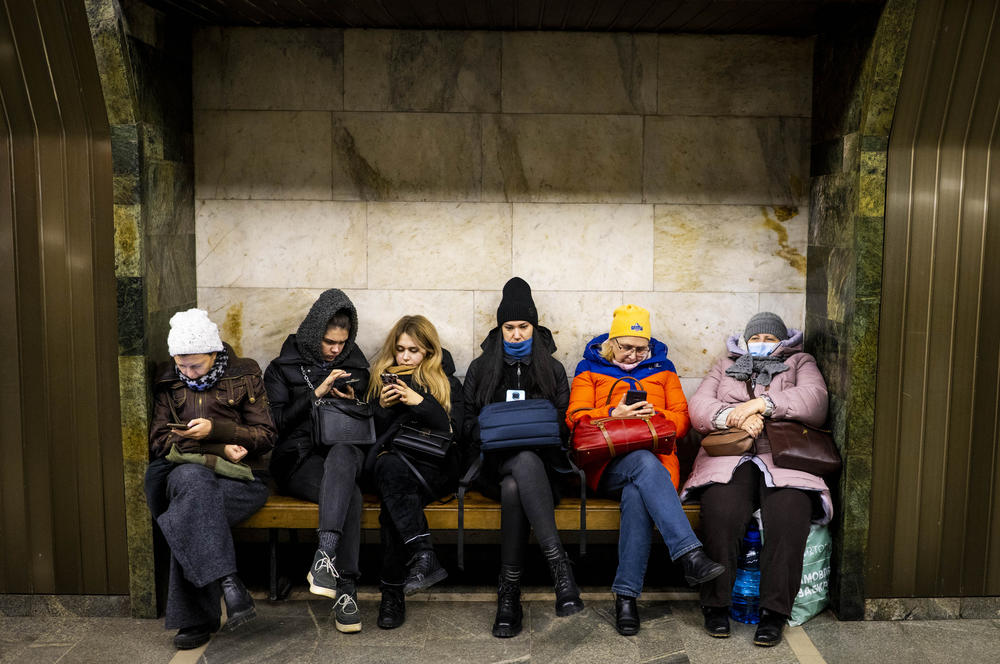 Civilians take shelter in Palats Sportu Metro during an air alert in Kyiv on Monday.