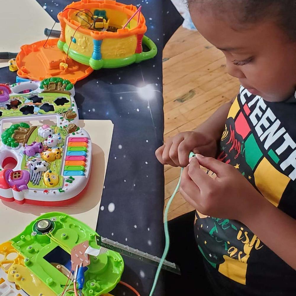 Kids learn circuit bending - how electronic toys generate sound.