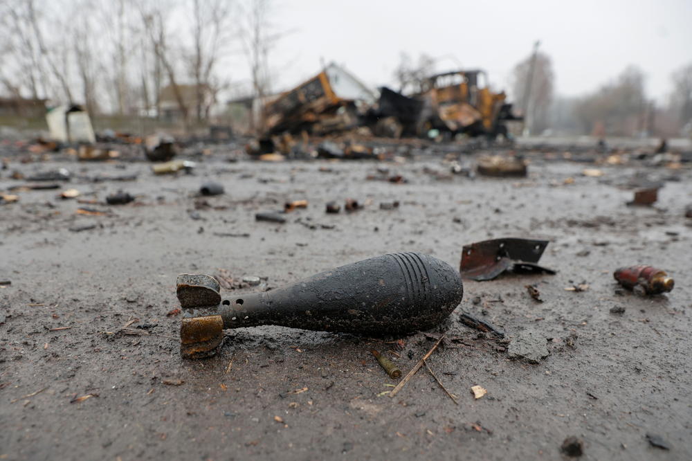 A mortar shell is seen next to a destroyed military vehicle in Nova Basan on April 1.