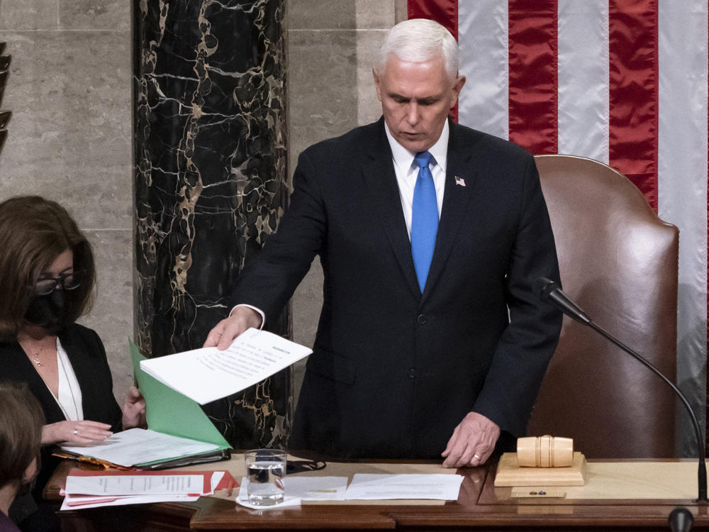 Legislation passed by Congress would clarify that the vice president's role in certifying the Electoral College vote is ceremonial. Here, then-Vice President Mike Pence is seen in the House chamber early on Jan. 7, 2021, to finish the work of the Electoral College after a mob loyal to President Donald Trump stormed the Capitol.