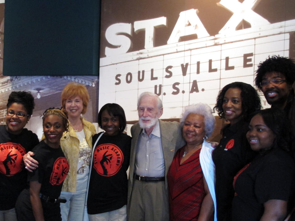 Stax Records co-founder Jim Stewart (center) poses for a photo with friends and students of the Stax Music Academy on April 29, 2013, in Memphis, Tenn. Stewart died Monday at age 92.