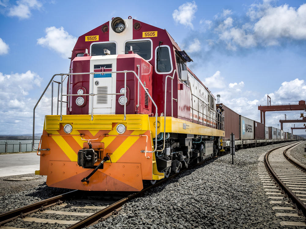 China's New Silk Road project is lending out billions to countries in Central Asia, the Middle East and Africa to build and upgrade railways, ports, pipelines, power grids and highways. Above: A Kenya Railways train pulls shipping containers as it departs from the Mombasa port station.