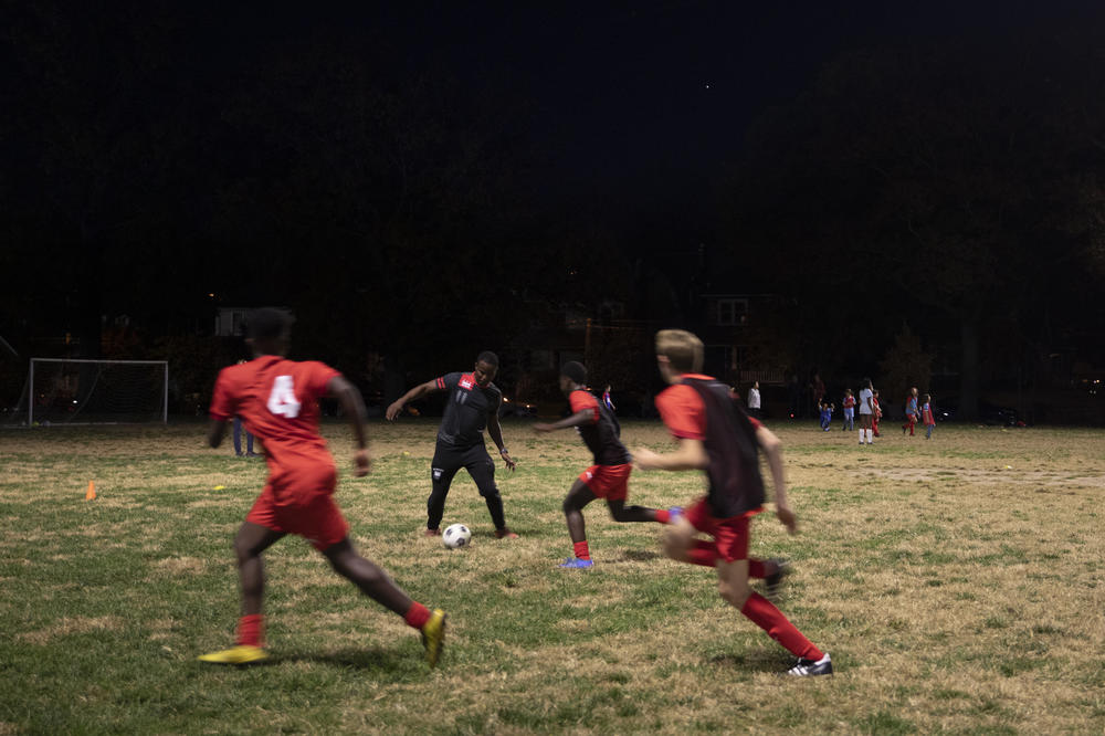 Coach Pierre Hedji plays alongside his team.