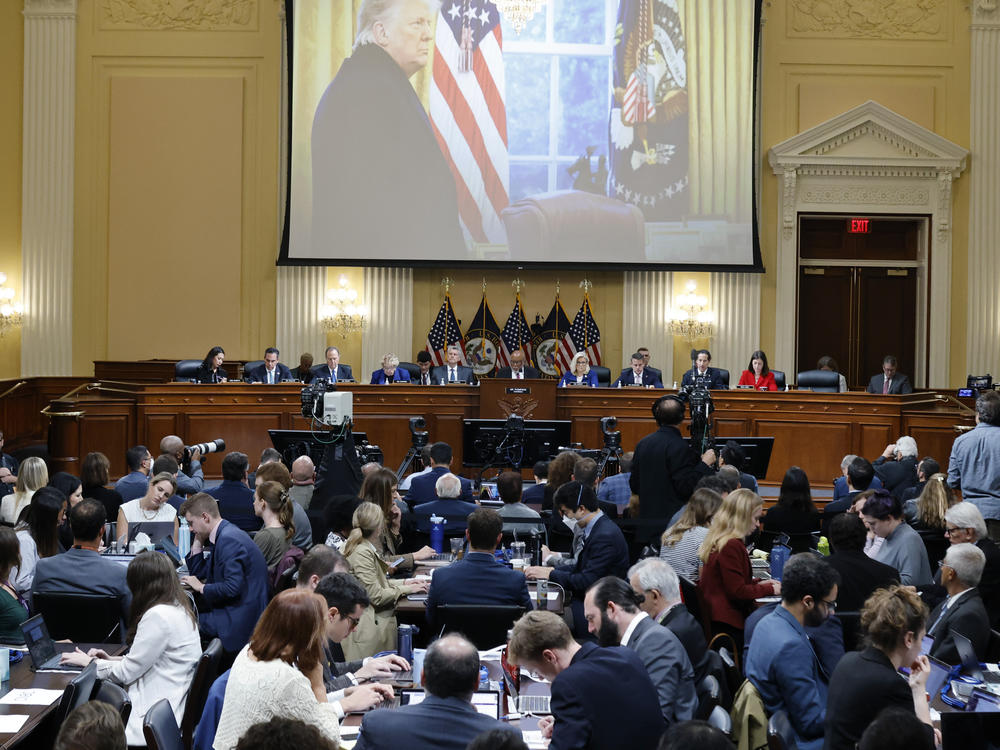 A photo of then-President Donald Trump speaking is displayed as the House select committee investigating the Jan. 6 attack on the Capitol holds a hearing on on Oct. 13.