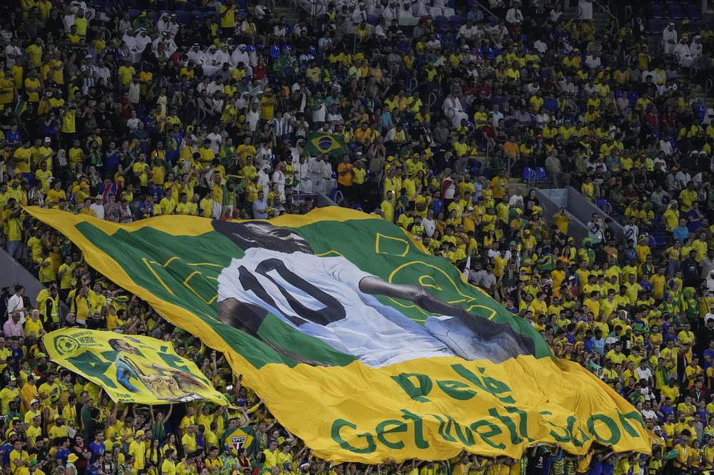Brazil's fans hold a giant banner showing the Brazilian soccer legend Pelé during a 2022 World Cup Round of 16 match against South Korea on Monday, Dec. 5, at Stadium 974 in Doha, Qatar.