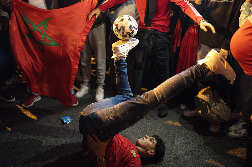 A Morocco fan juggles a soccer ball amid celebrations in Barcelona, Spain, after Morocco beat Spain in a penalty shoot-out in a Round of 16 World Cup match on Tuesday, Dec. 6, in Qatar.