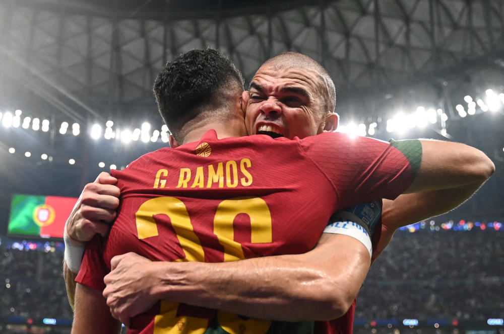 Portugal forward Goncalo Ramos (left, No. 26) celebrates with Portugal defender Pepe (No. 3) after scoring his team's first goal during a 2022 World Cup Round of 16 match with Switzerland on Tuesday, Dec. 6, at the Lusail Stadium in Lusail, north of Doha.