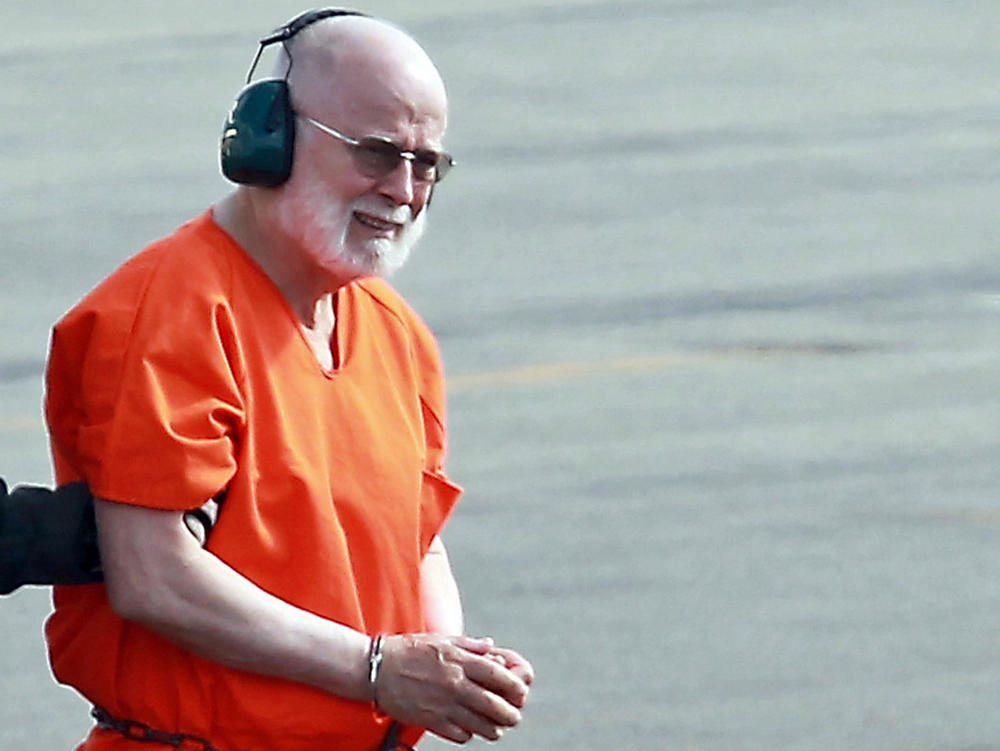 Whitey Bulger is taken from a Coast Guard helicopter to an awaiting Sheriff vehicle after attending federal court in Boston, on June 30, 2011.