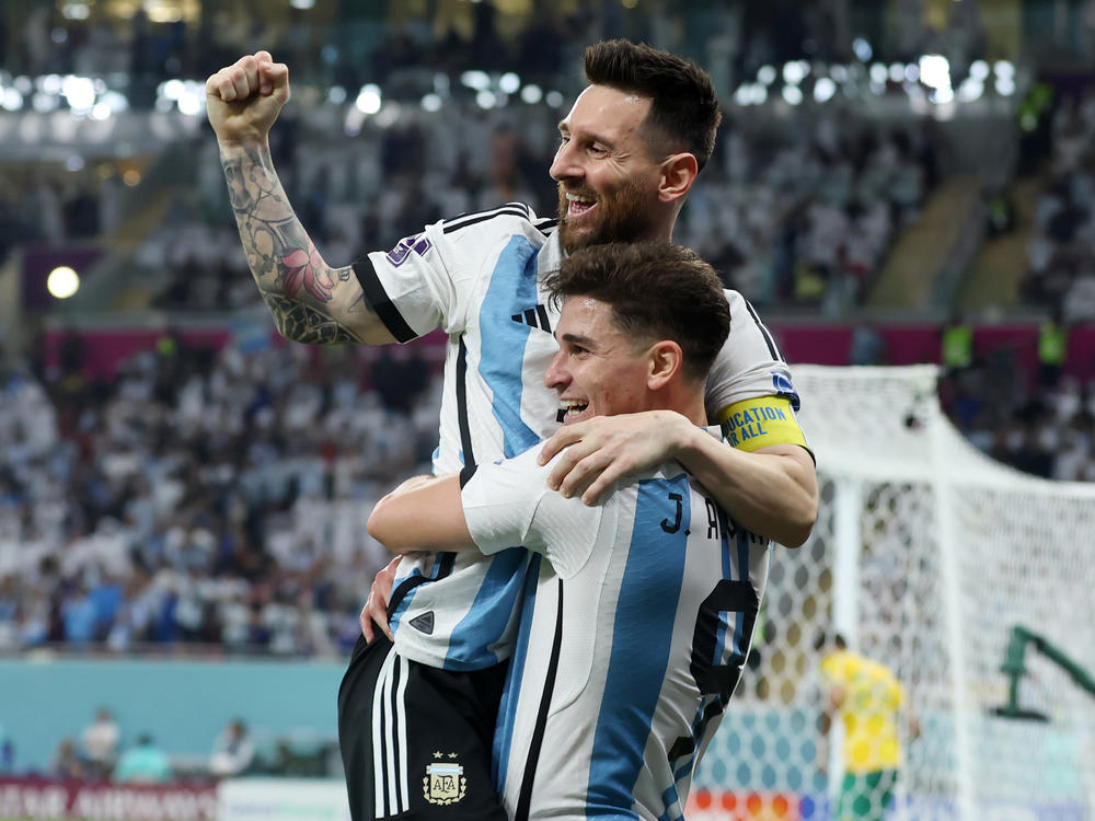 Argentina's Julián Álvarez celebrates while holding Lionel Messi after scoring the team's second goal during the 2022 World Cup's Round of 16 match with Australia at the Ahmad Bin Ali Stadium on Saturday, Dec. 3, in Doha, Qatar.