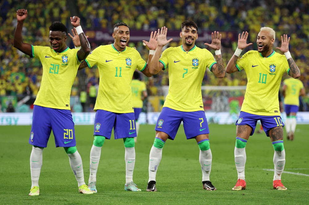 Neymar of Brazil (right) celebrates with Raphinha, Lucas Paqueta and Vinicius Junior after scoring a goal during the round of 16 match between Brazil and South Korea on Monday.