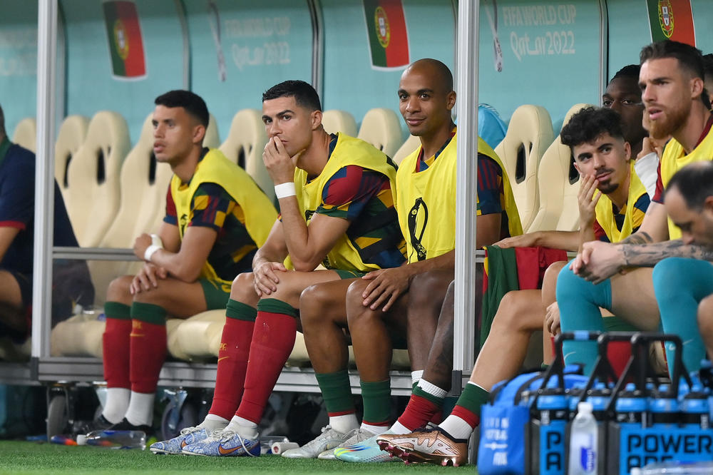 Portugal's Cristiano Ronaldo looks on from the bench during a 2022 World Cup Round of 16 match with Switzerland at the Lusail Stadium on Tuesday, Dec. 6, in Lusail City, Qatar. The game represented the first time Ronaldo hadn't started a World Cup match since 2006.