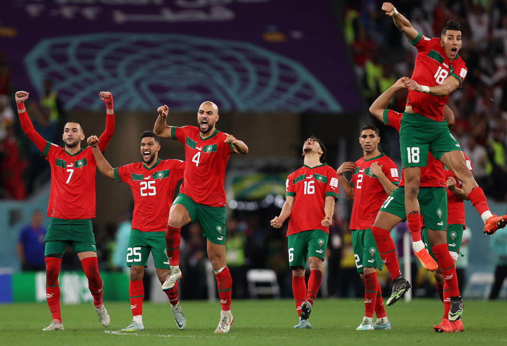 Morocco's players celebrate after a penalty shoot-out during a 2022 World Cup Round of 16 match secured their win against Spain at the Education City Stadium on Tuesday, Dec. 6, in Al Rayyan, Qatar.