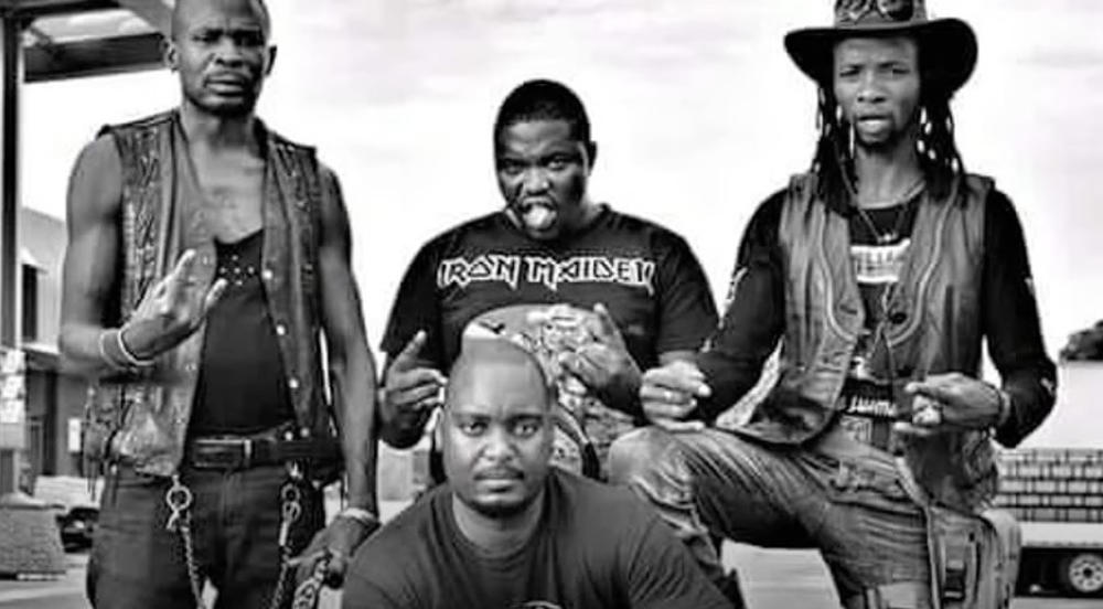 A screenshot from a music video depicting members of the Botswana heavy metal band, Overthrust. Tshomarelo 