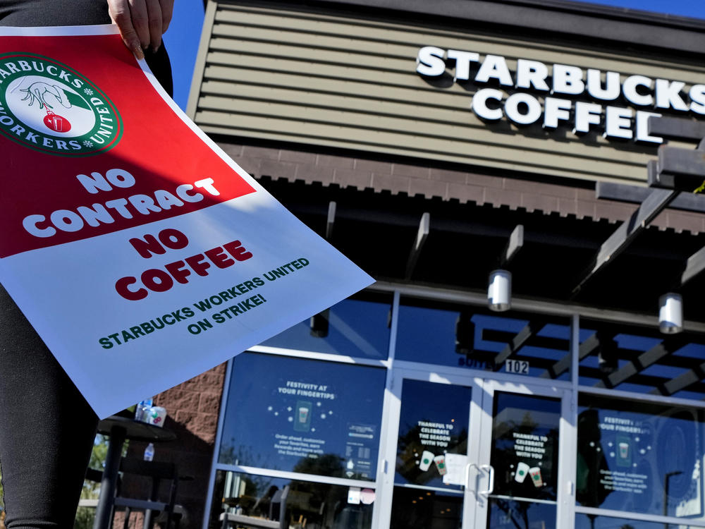 Starbucks employees strike outside their store on Nov. 17 in Mesa, Ariz.