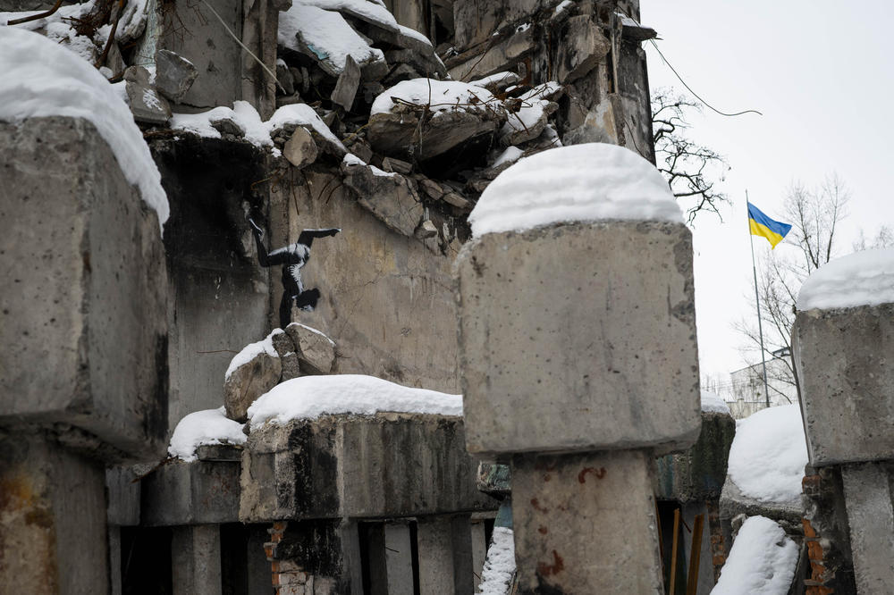 Art by British street arstist Banksy on a damaged building in Borodianka on Monday.