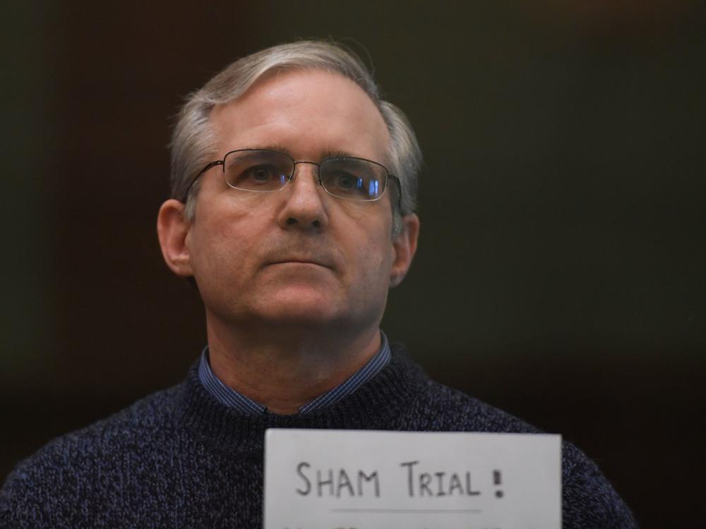 Paul Whelan holds a sign in protest as he awaits his verdict in Moscow in June 2020. He was sentenced to 16 years in prison on charges of espionage.