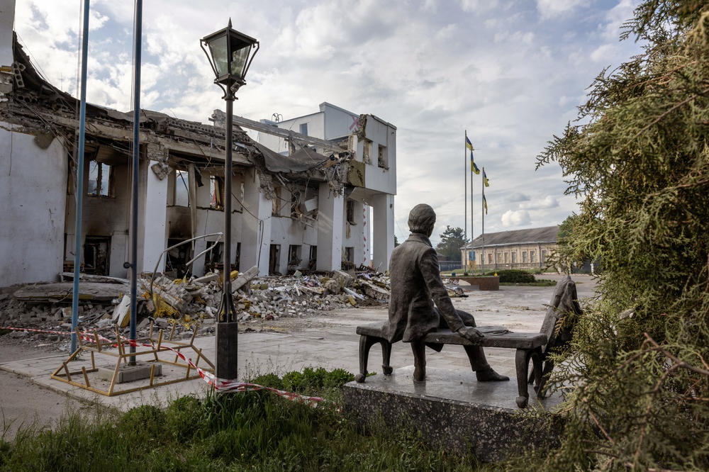 A sculpture of Ukrainian national hero and bard Taras Shevchenko sits near the ruins of the local Palace of Culture in Dergachi, Ukraine, on May 14. The building had most recently been used as a humanitarian aid distribution center for Ukrainian civilians before being destroyed by a missile strike on May 11.