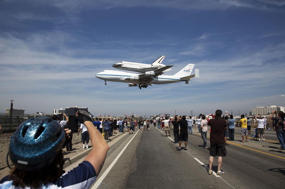 The space shuttle Endeavour, mounted atop a NASA 747 Shuttle Carrier Aircraft lands at Los Angeles International Airport, on Sept. 21, 2012.