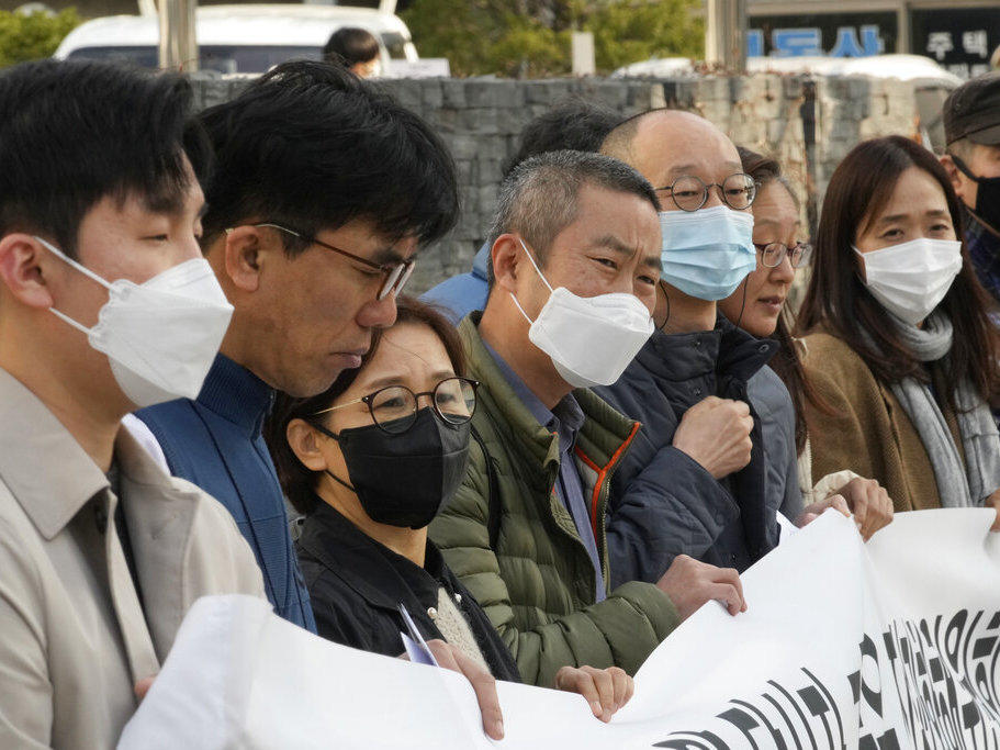 Peter Møller, fourth from left, an attorney and co-founder of the Danish Korean Rights Group, attends a Nov. 15 press conference with a group of South Korean adoptees in front of the Truth and Reconciliation Commission in Seoul, South Korea. Seoul faces growing pressure to reckon with the child export frenzy driven by dictatorships that ruled the country until the 1980s.