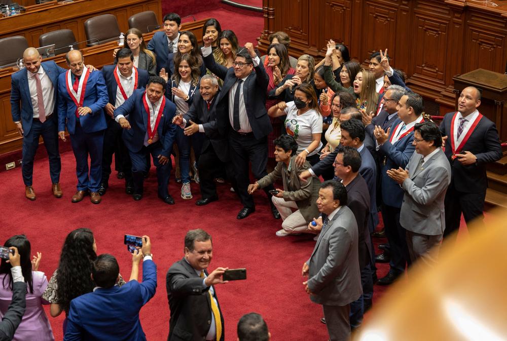 Peruvian congress members pose for a picture after the vote for the impeachment of President Pedro Castillo in Lima on Wednesday.