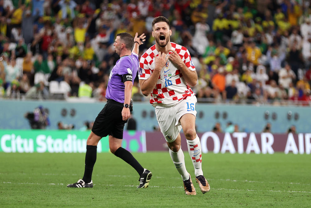 Bruno Petković of Croatia celebrates after evening the game 1-1 in extra time against Brazil in the World Cup quarterfinals on December 09, 2022 in Al Rayyan, Qatar.