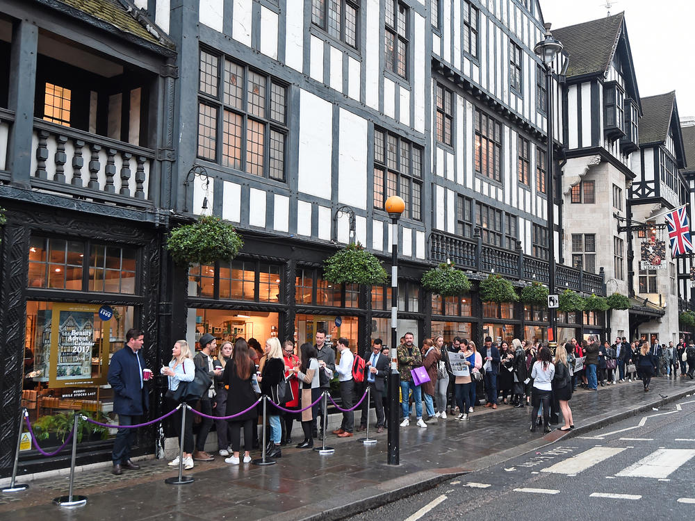 Customers form a line around the block at 8 a.m. for the launch of the 2017 Liberty London Beauty Advent Calendar in London in October 2017.