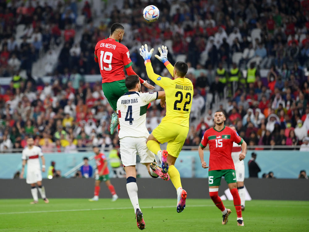 Youssef En-Nesyri of Morocco soars high to head the ball and score the team's first goal during Morocco-Portugal quarterfinal at the World Cup in Qatar on December 10, 2022.