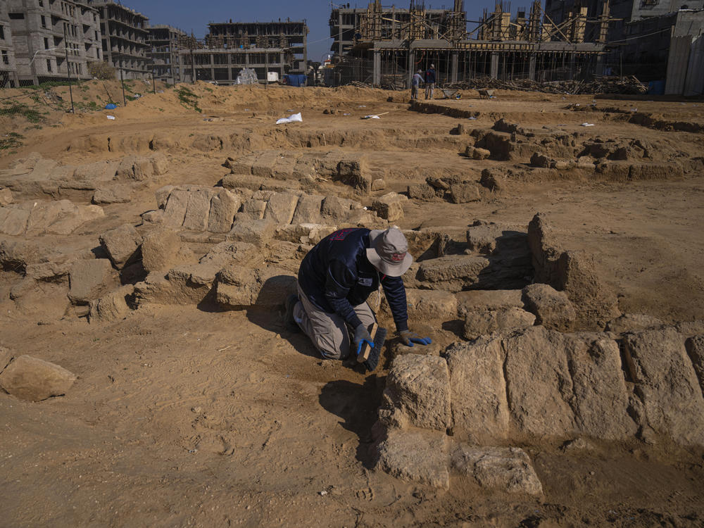 A Palestinian excavation team works in a newly discovered Roman-era cemetery in the Gaza Strip on Sunday. Authorities in Gaza announced the discovery of over 60 tombs in the ancient burial site.