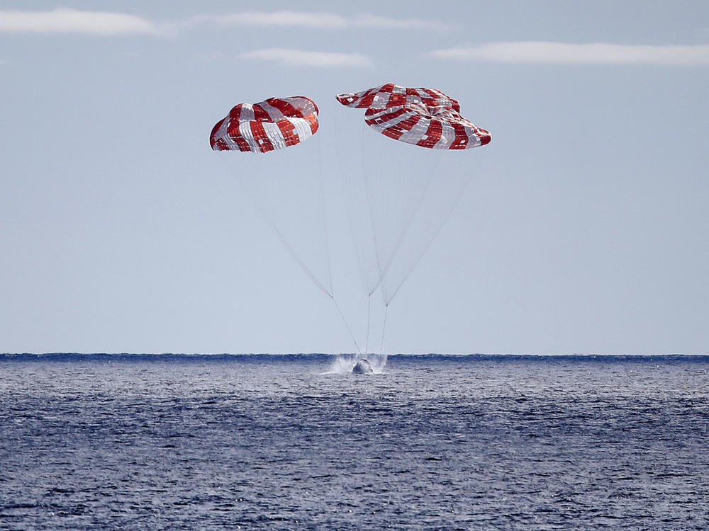 NASA's Orion Capsule splashes down after a successful uncrewed Artemis I Moon Mission on Sunday, seen from aboard the USS Portland in the Pacific Ocean off the coast of Baja California, Mexico.