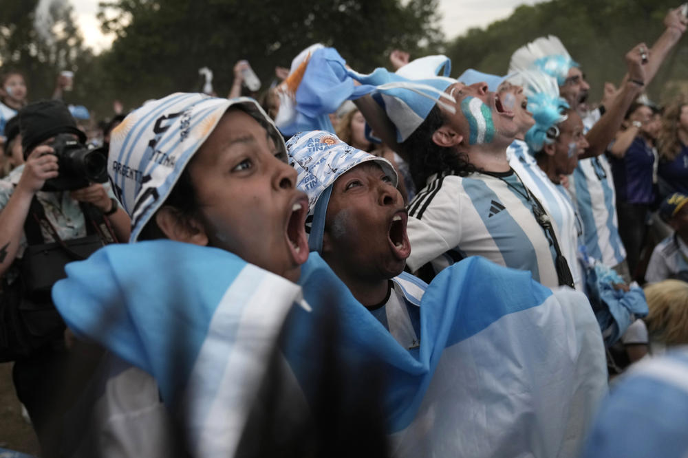 Argentina's fans watch a penalty shootout on a screen in Buenos Aires as their team works to beat the Netherlands, 4-3, in a 2022 World Cup quarterfinal match on Friday, Dec. 9.