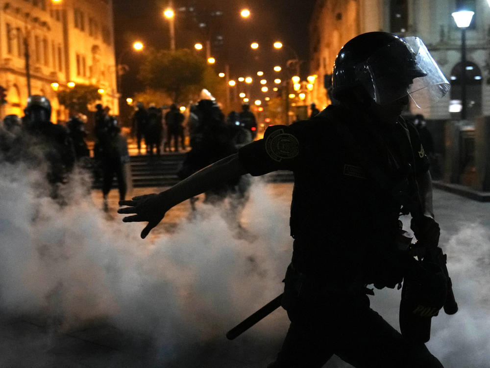 Police trying to break up supporters of ousted President Pedro Castillo at plaza San Martin in Lima, Peru, Sunday, Dec. 11, 2022.