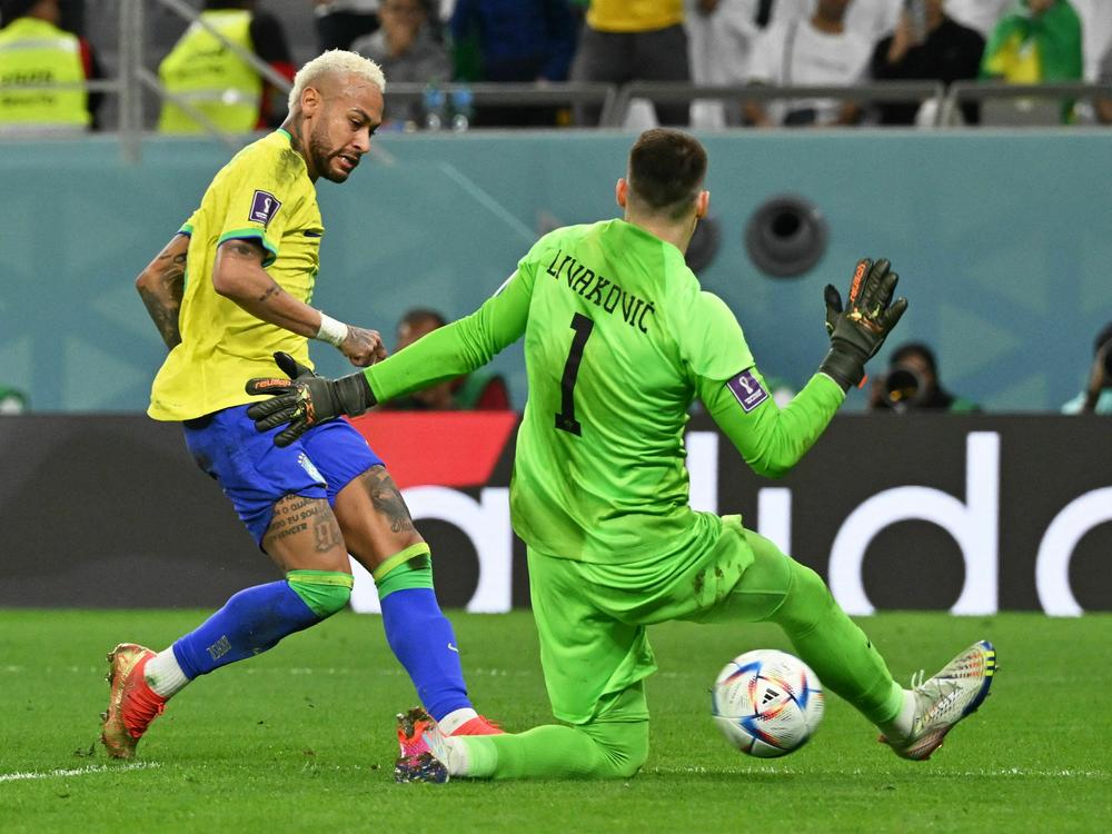 Croatia goalkeeper Dominik Livaković snuffs out Brazil forward Neymar during the World Cup quarterfinal match on Dec. 9, 2022.