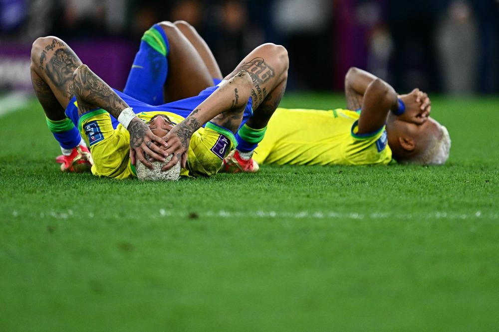 Brazil's forwards Neymar (left) and Rodrygo react after losing in a penalty shoot-out after extra time of a 2022 World Cup quarterfinal match with Croatia on Friday, Dec. 9, at the Education City Stadium in Al-Rayyan, west of Doha, Qatar.