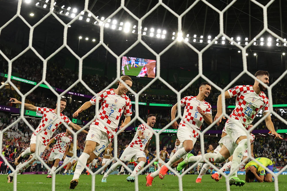 Croatia's players celebrate their victory in a 2022 World Cup quarterfinal match against Brazil on Friday, Dec. 9, at the Education City Stadium in Al-Rayyan, west of Doha, Qatar.