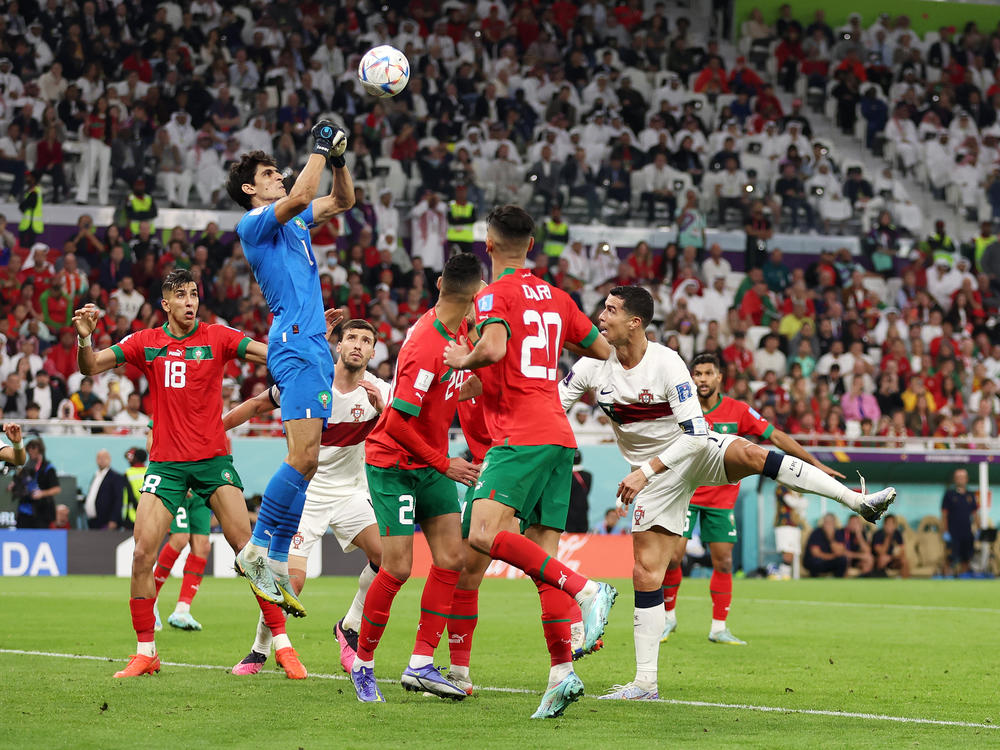 Yassine Bounou of Morocco makes a save during the the World Cup quarterfinal between Morocco and Portugal. Goalkeepers have powered the final four teams left in the tournament.