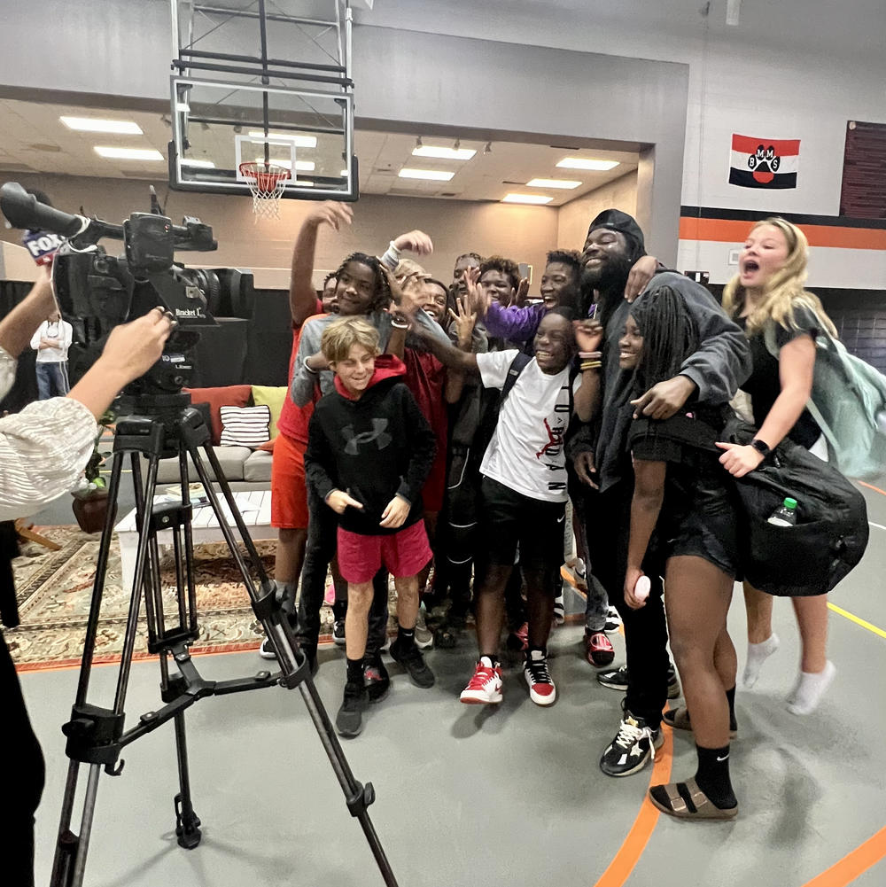 Reynolds poses for a selfie with students during a visit to Bay Minnette Middle School in Bay Minette, Ala., in Oct. 2022.