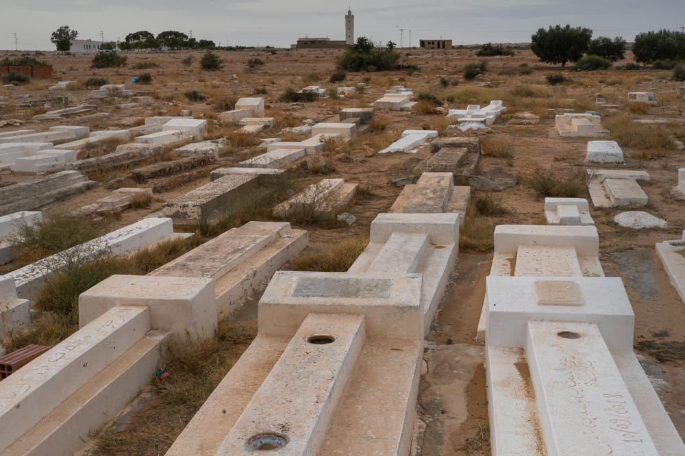 Bouazizi's grave (center bottom) is a simple resting place nestled in a small cemetery outside his family village. The epitaph reads 