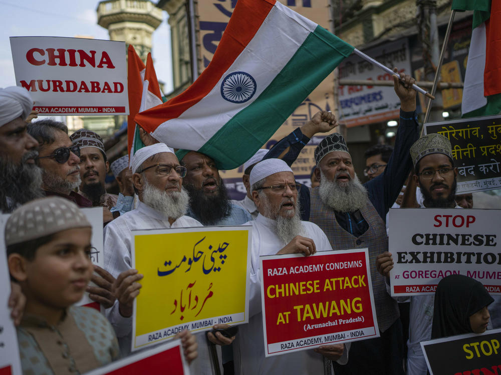 Indians hold placards as they shout slogans during a protest against China in Mumbai, on Tuesday. Soldiers from India and China clashed last week along their disputed border, India's defense minister said.