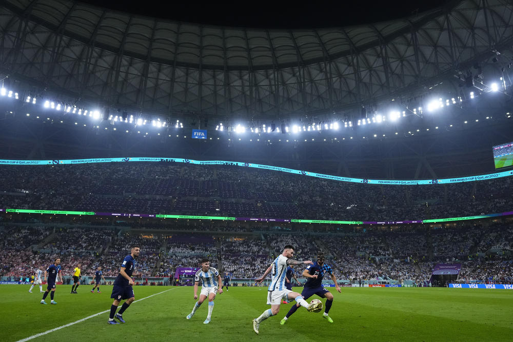 Argentina's Lionel Messi and Croatia's Joško Gvardiol, right, battle for the ball during a 2022 World Cup semifinal match on Tuesday, Dec. 13, at the Lusail Stadium in Lusail, Qatar.