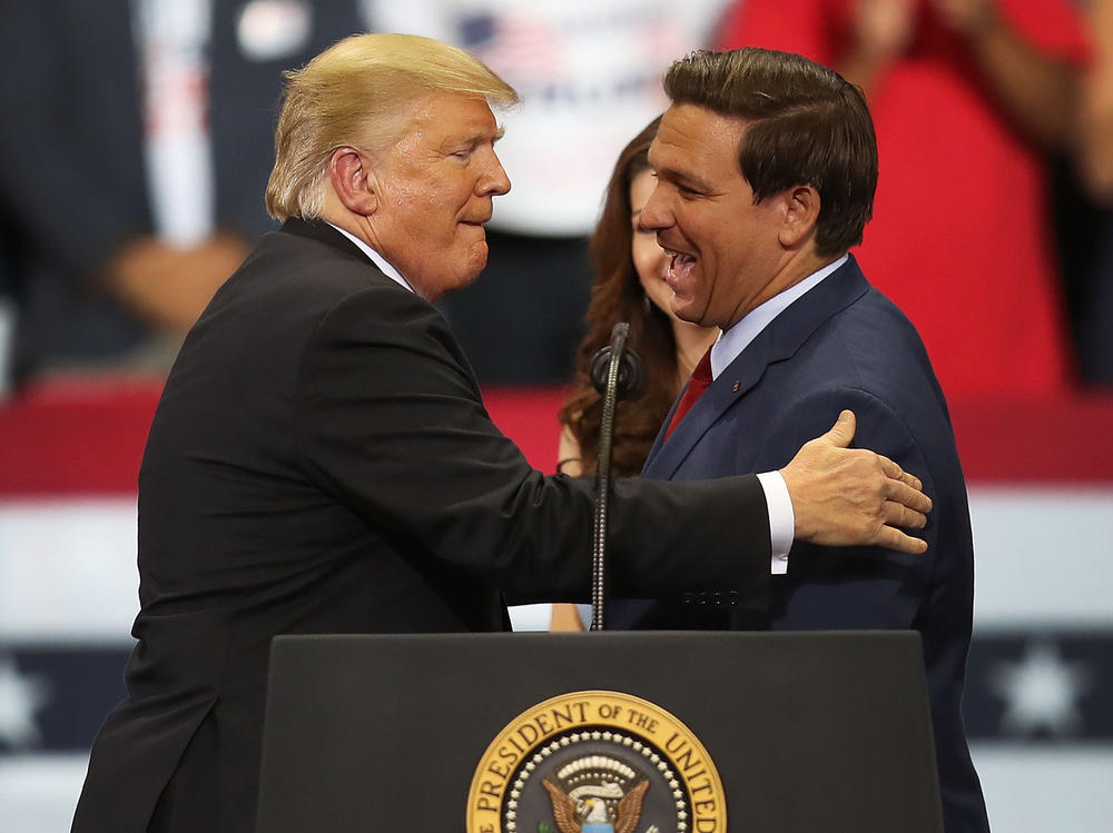 Then-President Donald Trump greets then-Florida Republican gubernatorial candidate Ron DeSantis during a campaign rally at the Hertz Arena on Oct. 31, 2018 in Estero, Fla. In 2024, the two candidates may run against one another for president.